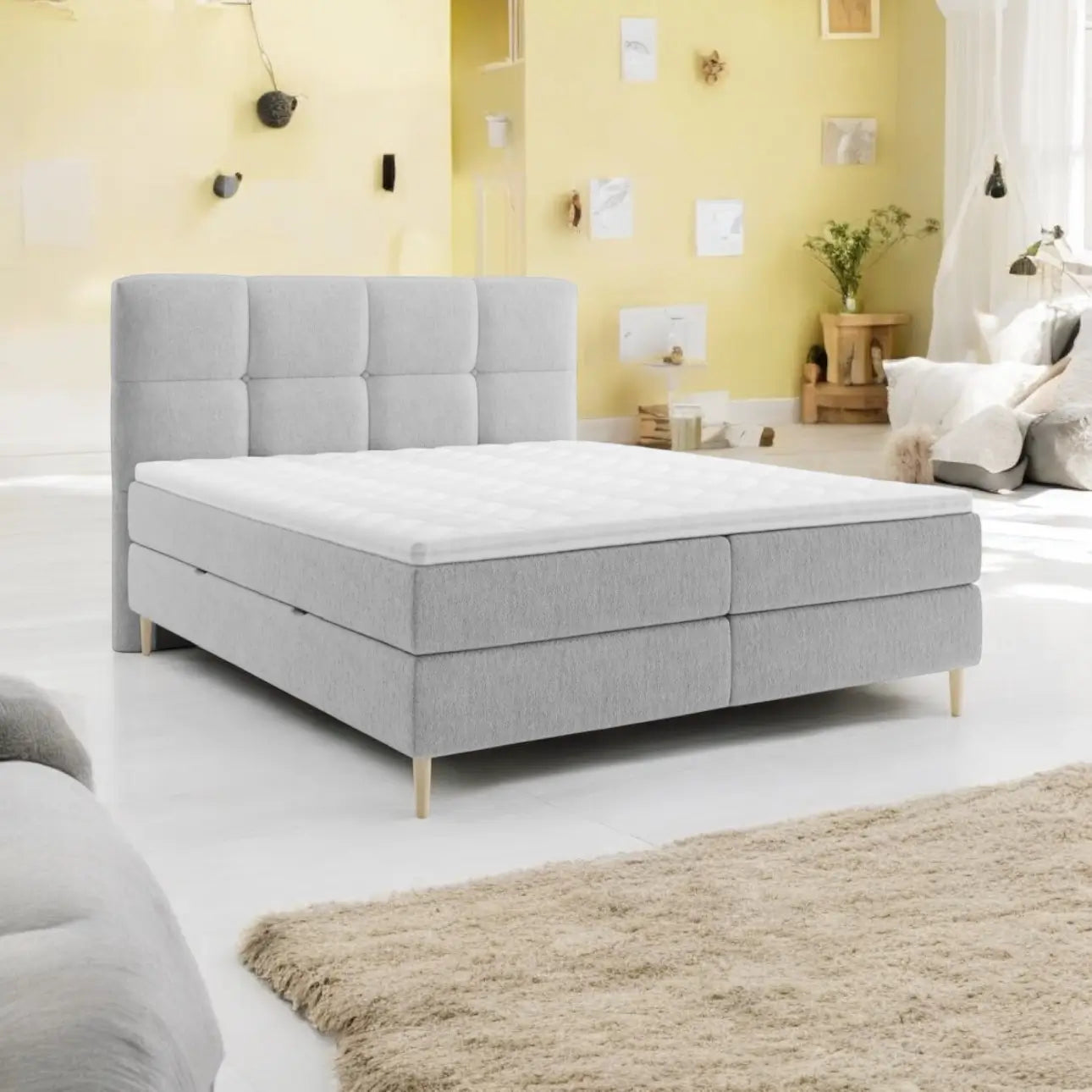 Lit BOXSPRING LEO - Avec tête de lit, coffre intégré, matelas ressorts ensachés et surmatelas inclus