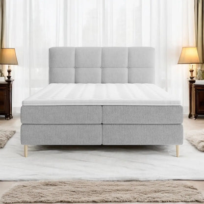 Lit BOXSPRING LEO - Avec tête de lit, coffre intégré, matelas ressorts ensachés et surmatelas inclus